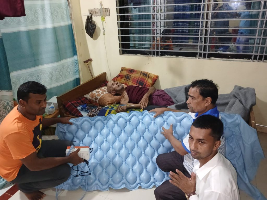 Photo Caption:
Leaders of the Bangladesh Buddhist Youth Council–Ukhiya install a surgical bed for elderly monk Venerable Shraddhasen at his home in Purba Valukia, Ukhiya.